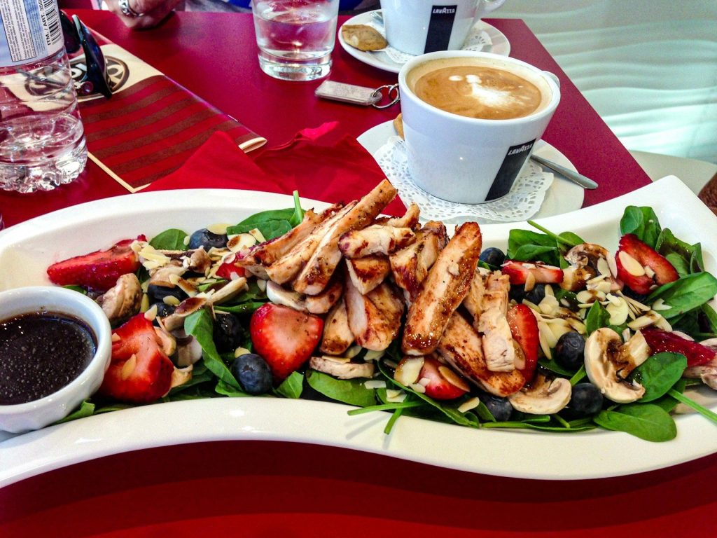 Grilled chicken salad with strawberries and blueberries