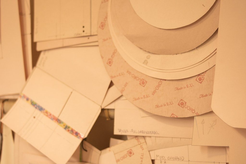 a pile of white plates and paper on top of each other