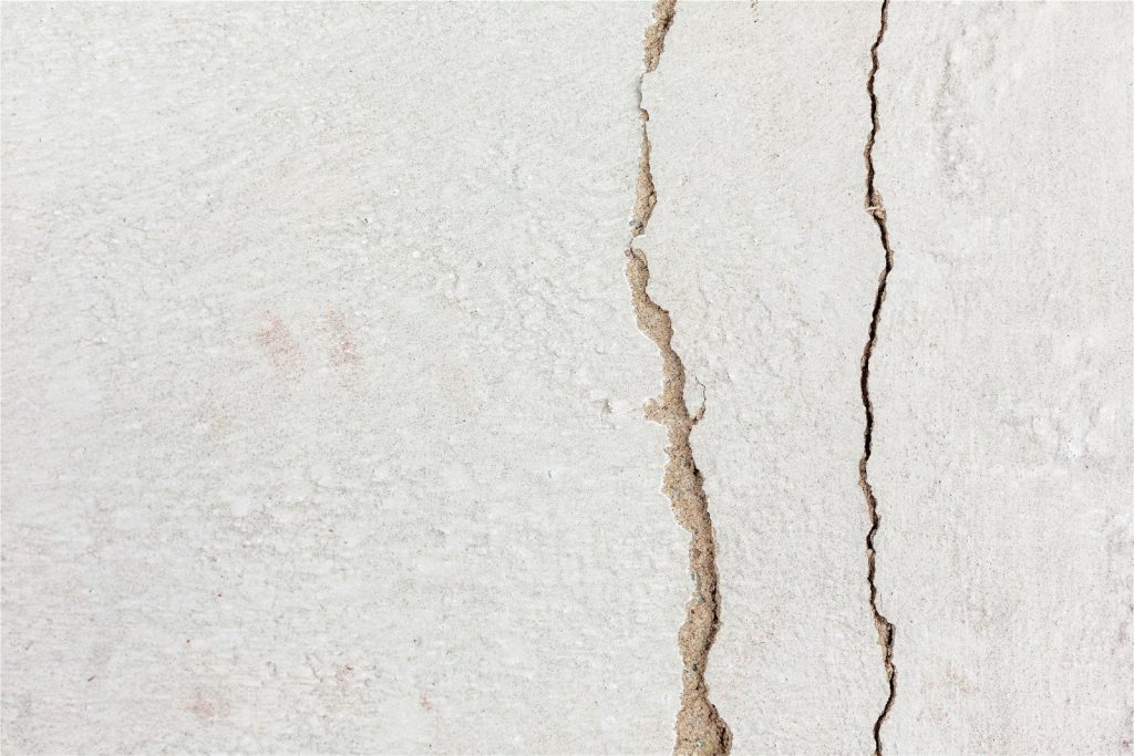 a crack in the side of a white wall