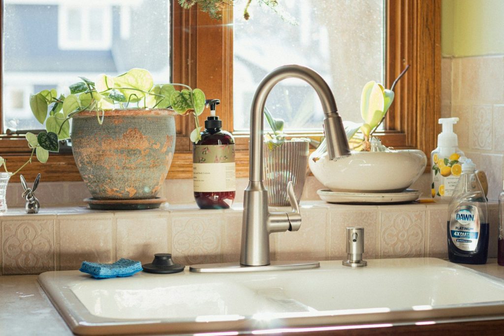 a sink in a kitchen next to a window