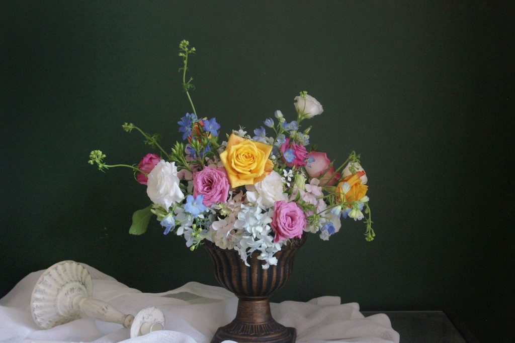 A vase filled with flowers sitting on top of a table