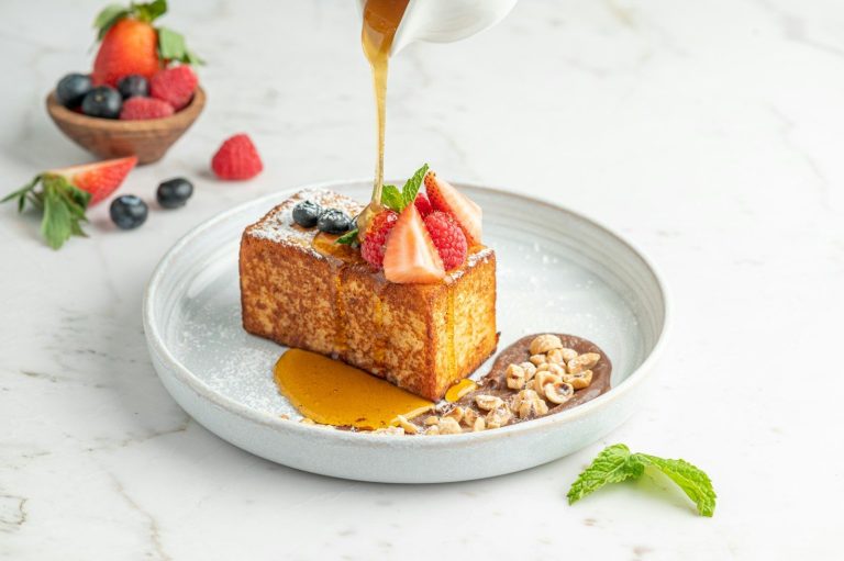 a piece of cake is being drizzled with syrup