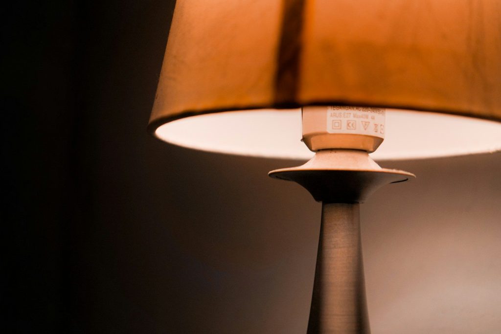A close-up of a lamp with a warm glow.