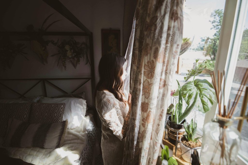 woman looking at window