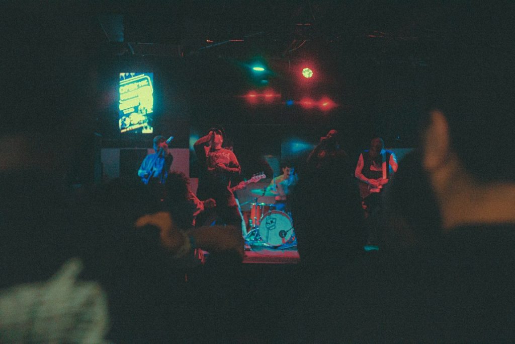a group of people standing on a stage in front of a crowd