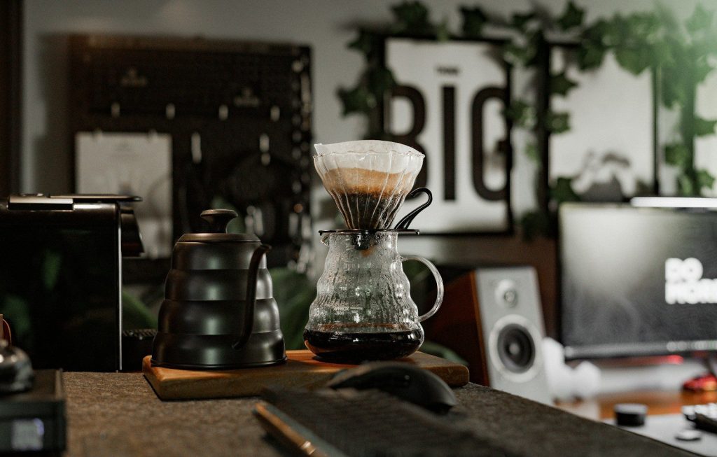 a coffee maker sitting on top of a wooden table