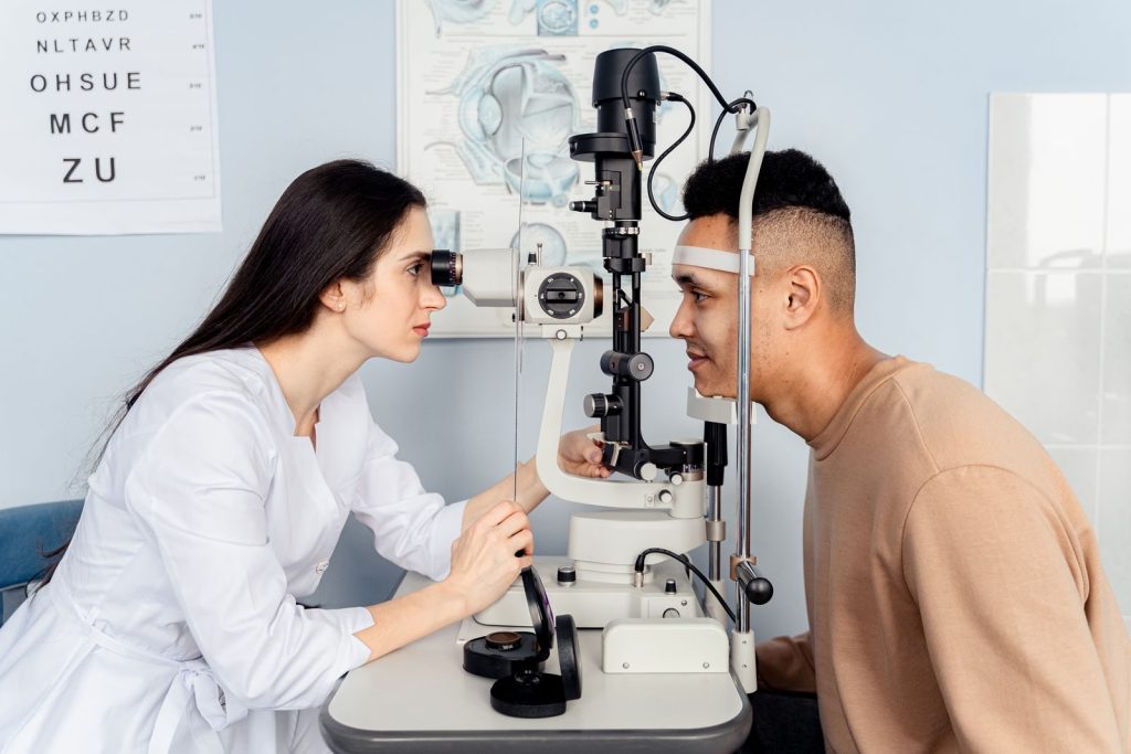Professional eye examination conducted by an optometrist using modern equipment with a patient.