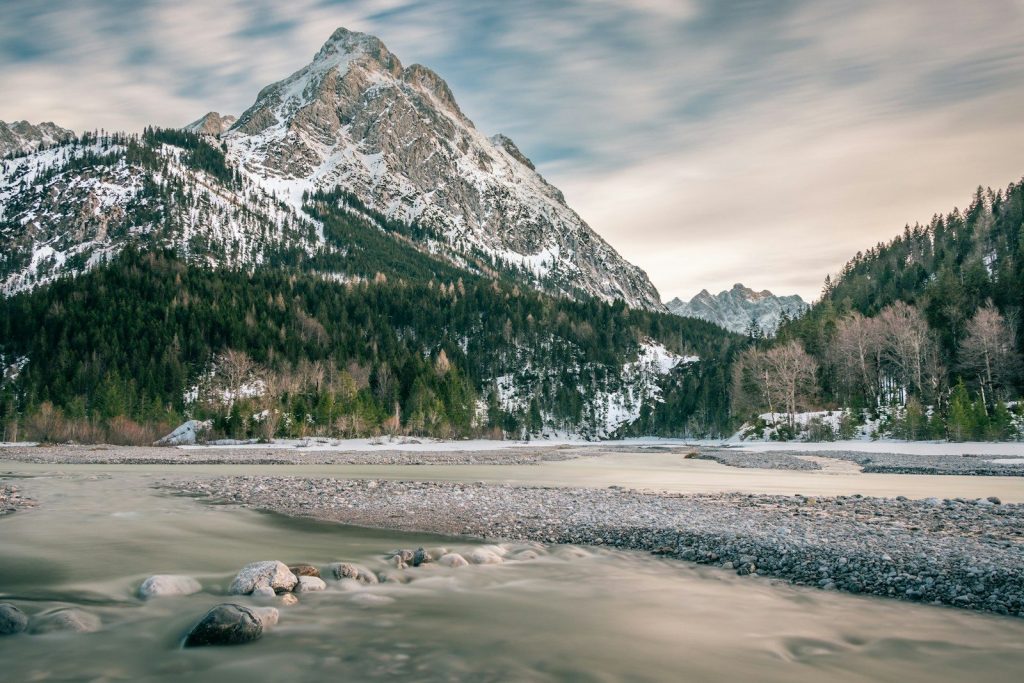 body of water near mountain