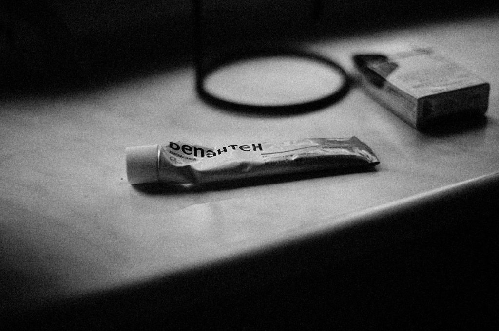 a bar of soap and a magnifying glass on a table