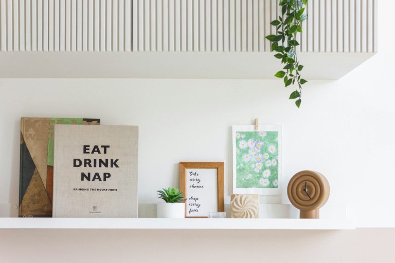 Shelf with books, art, and decor