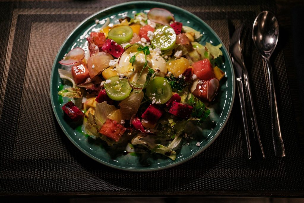 Fresh salad with colorful vegetables and cheese
