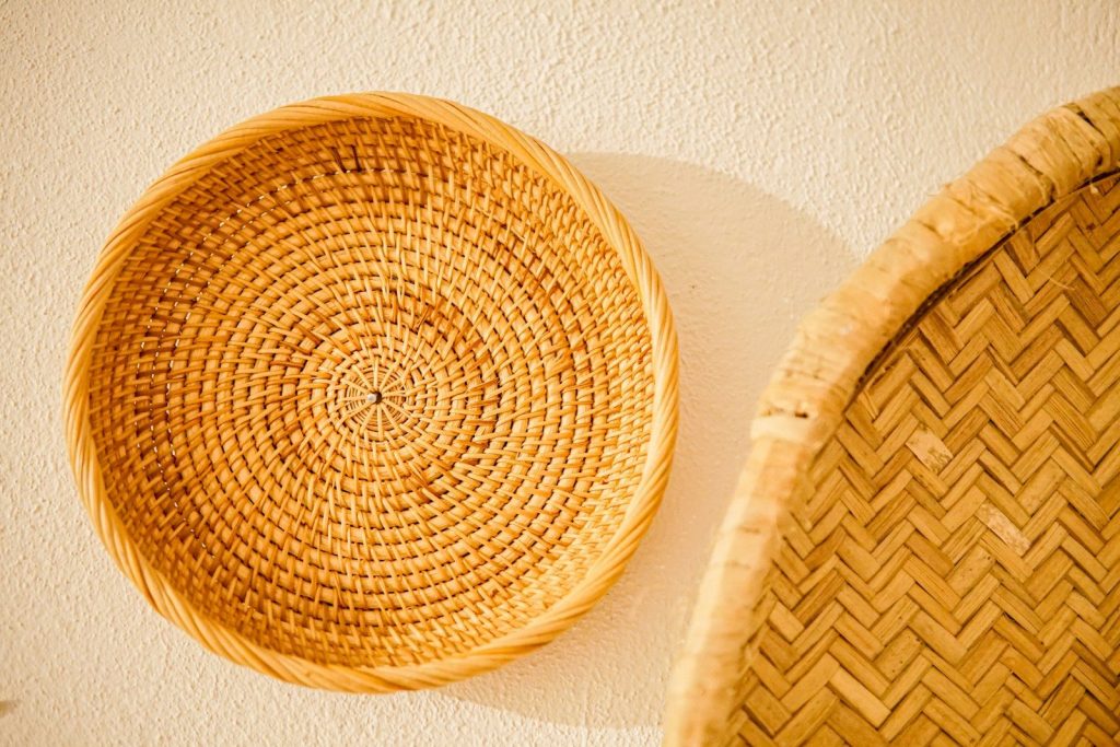 a close up of two baskets on a wall