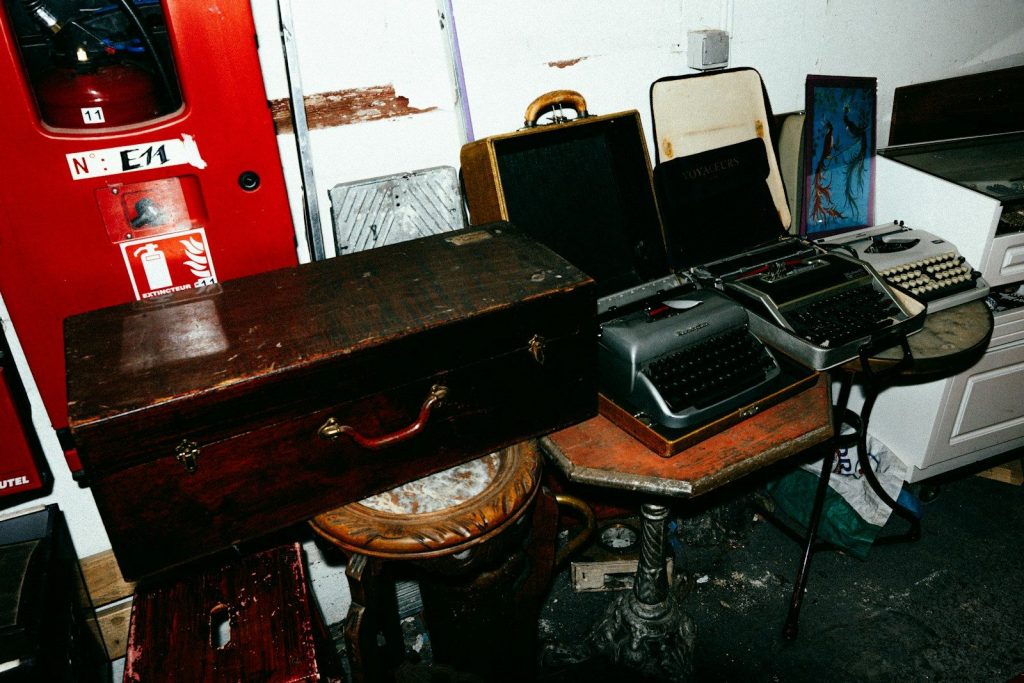 Vintage typewriters and luggage on display