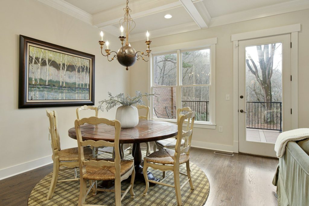 A dining room with a table and chairs