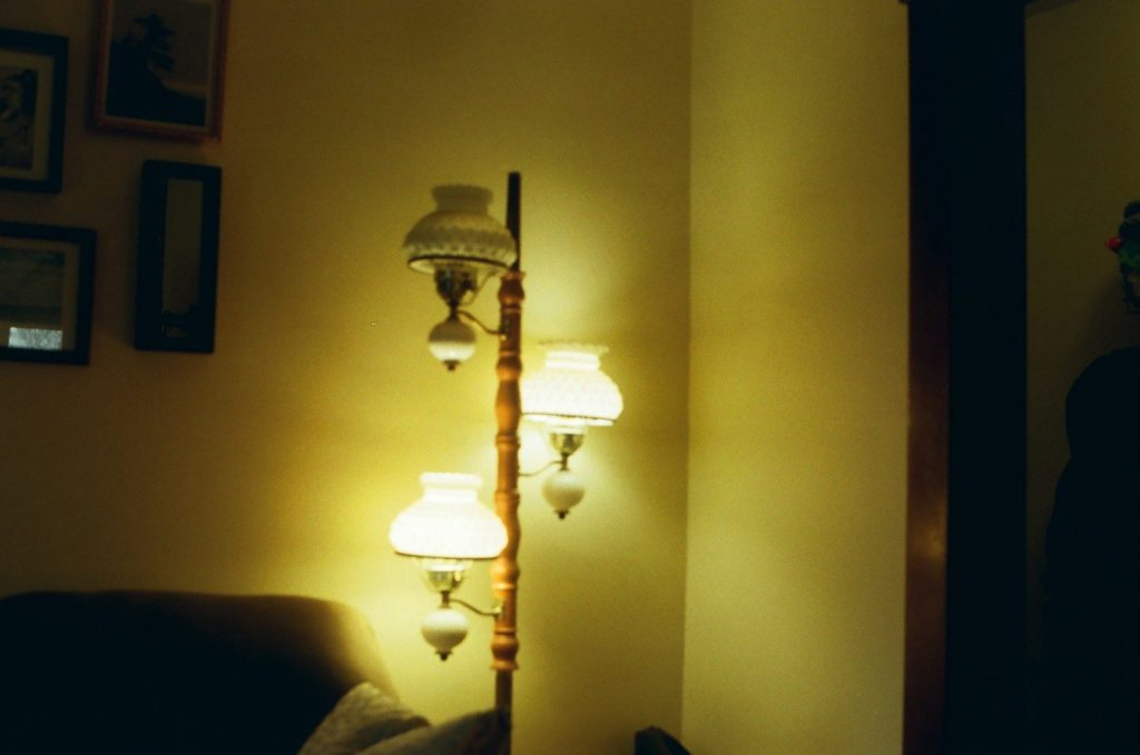 a room with lamps on the wall