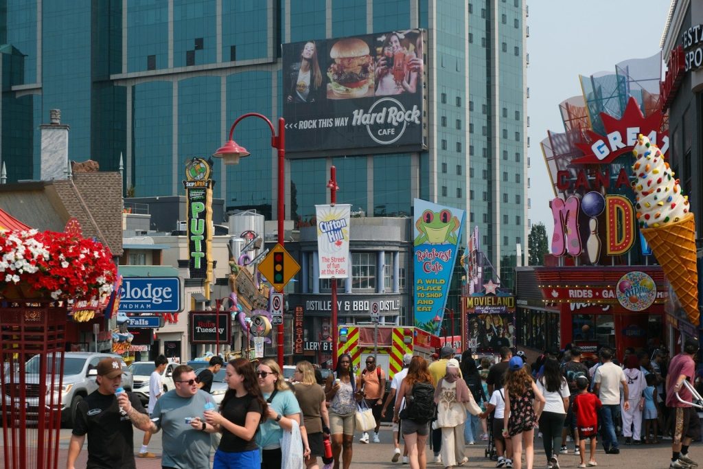 Crowded street with shops and tourists