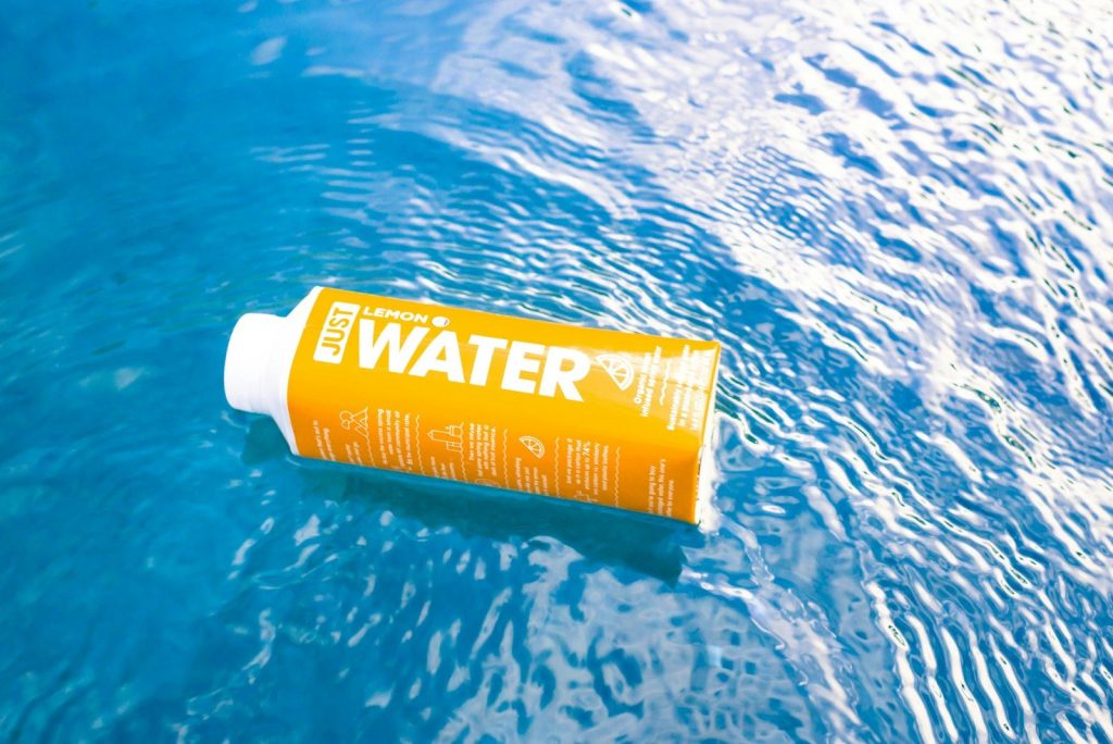 yellow and white plastic tube bottle