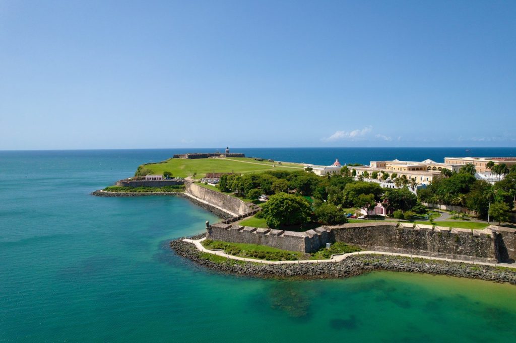 Historic fortress on a coastal peninsula under clear blue sky