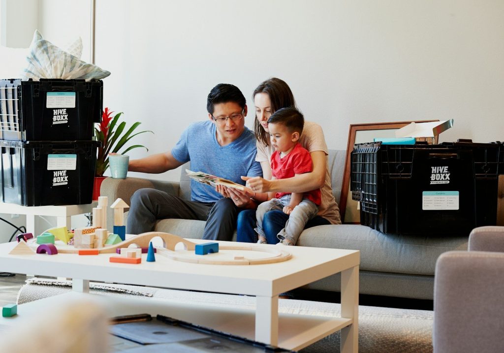 man and woman sitting on couch