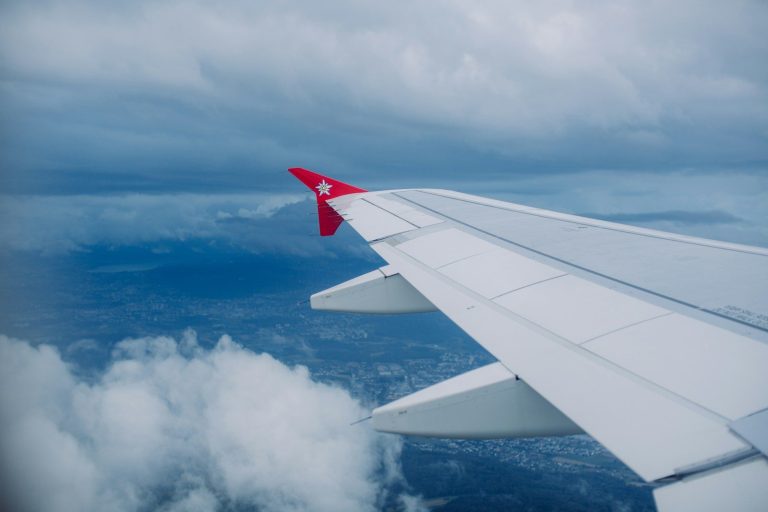 a view of the wing of an airplane in the sky
