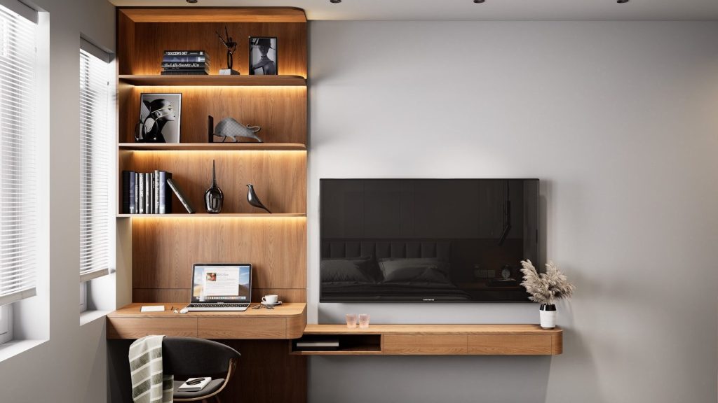 Modern office with wooden shelves and television.