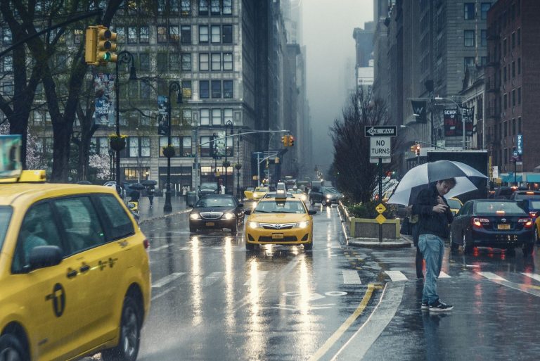 man standing on road