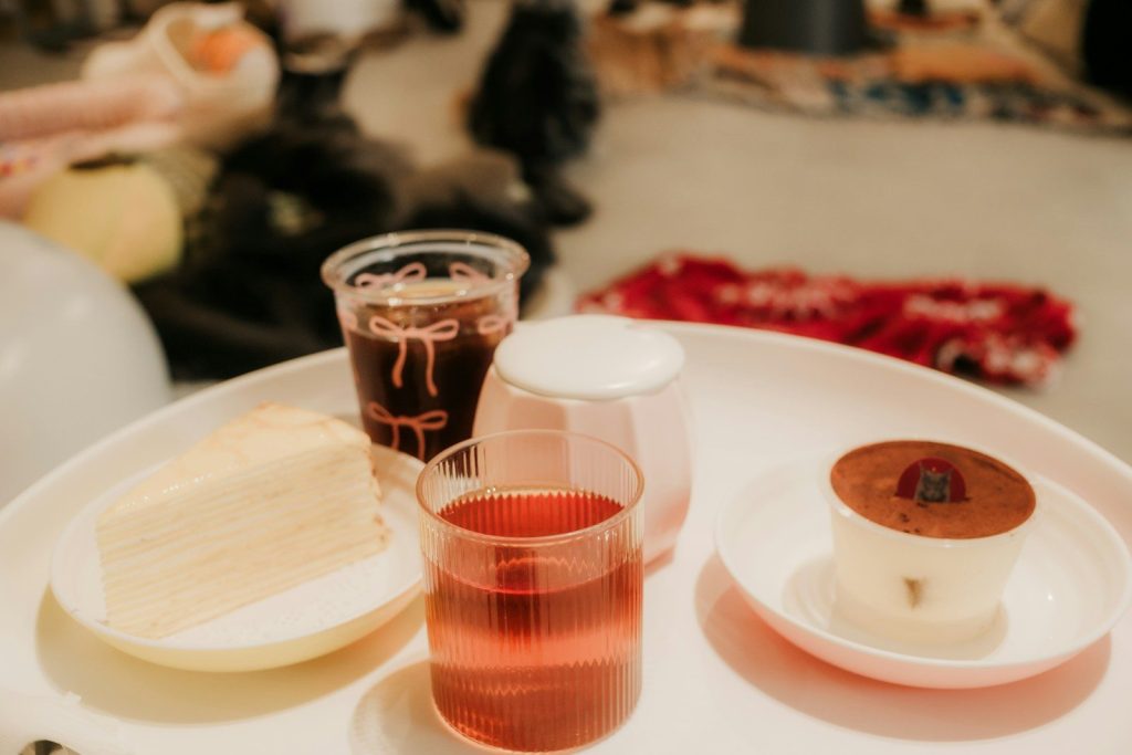 Dessert platter with cake, mousse, and drinks