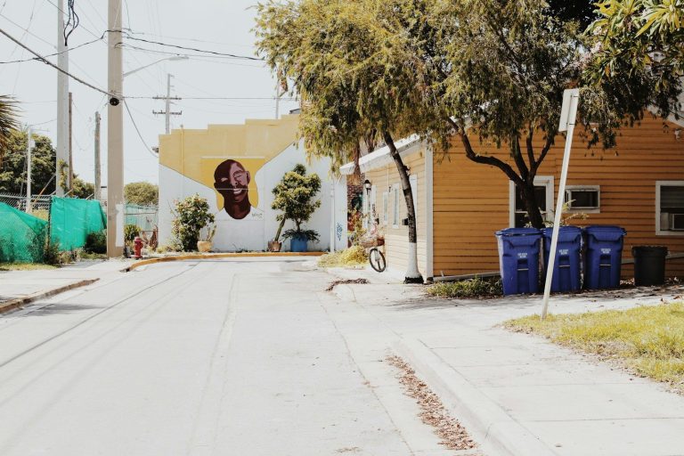 a street with a building and trees