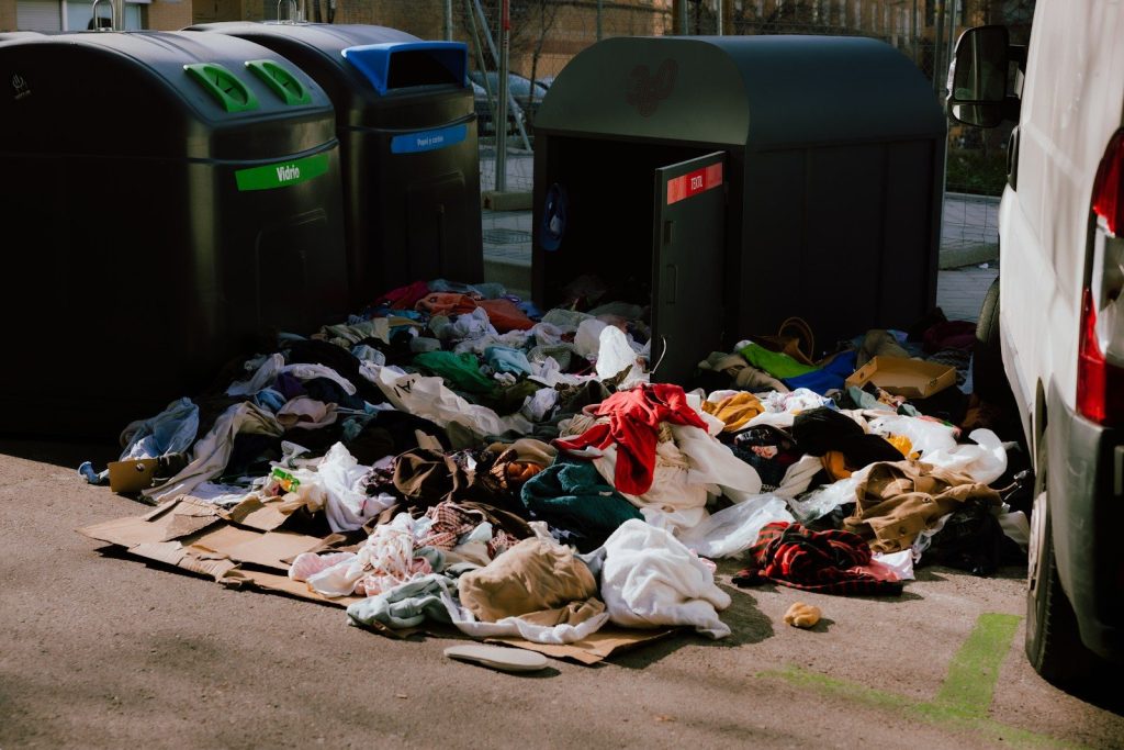 A pile of trash sitting next to a white van