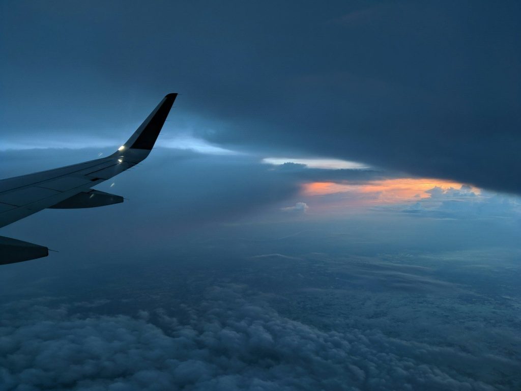 airplane above clouds during day