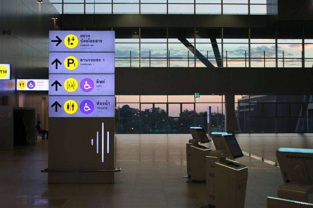 Airport signs with directions and icons
