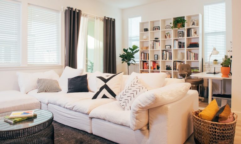 A living room filled with furniture and a large window