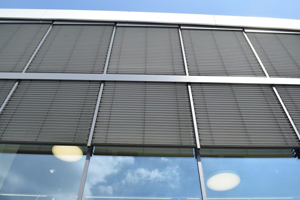 a building with a lot of windows and a sky background