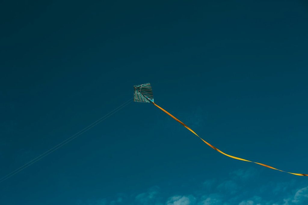 gray and yellow kite during daytime