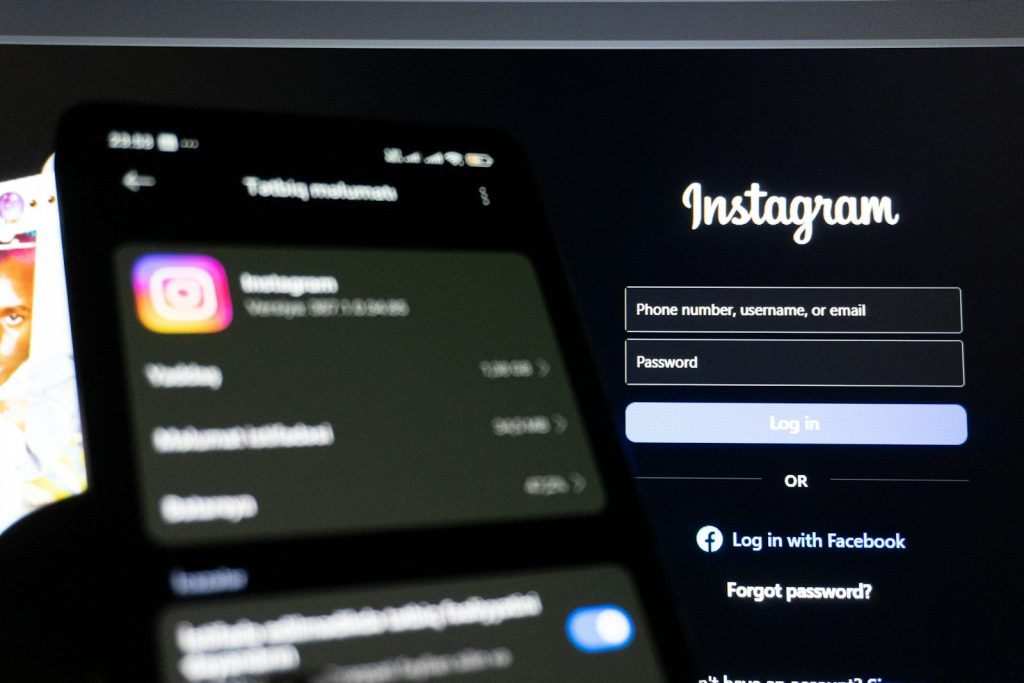 Instagram app on phone and login screen.