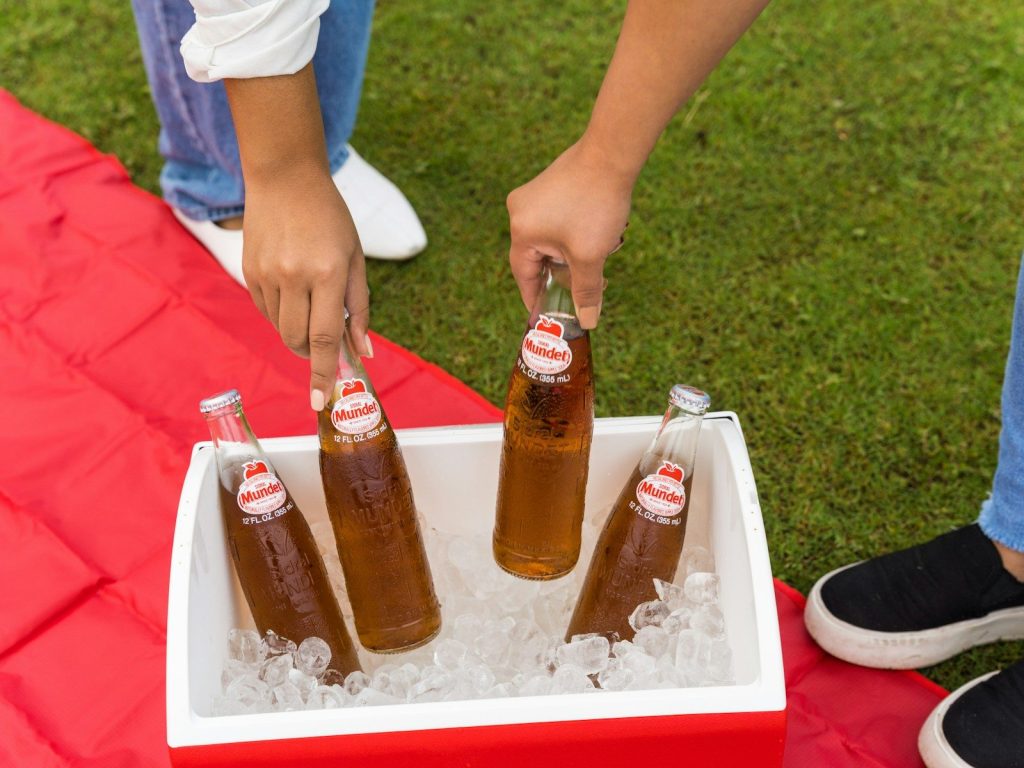 person holding coca cola bottle