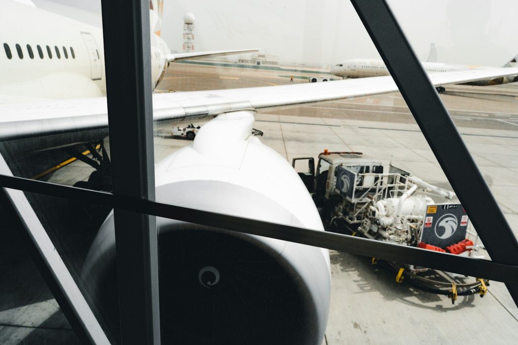 a plane with a car on the wing