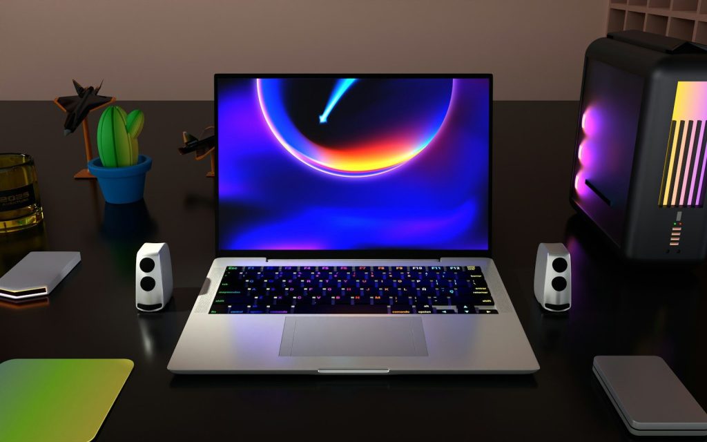 a laptop computer sitting on top of a desk