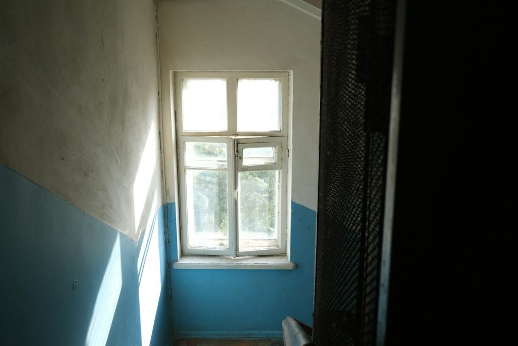 white wooden framed glass window