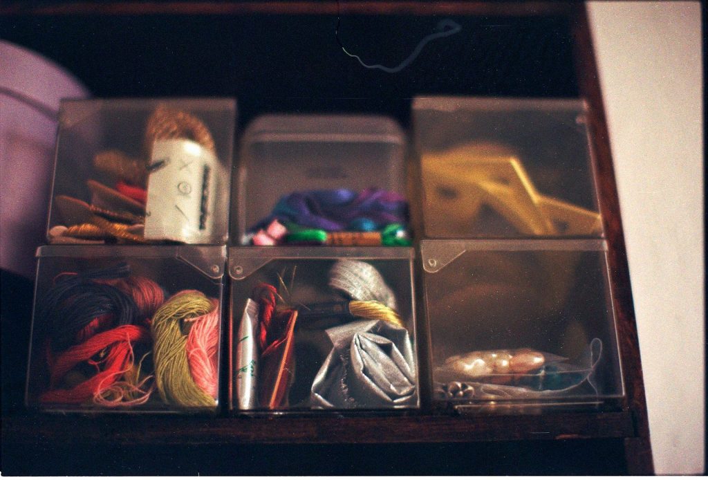Clear containers filled with craft supplies