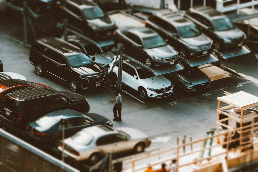 a parking lot filled with lots of parked cars